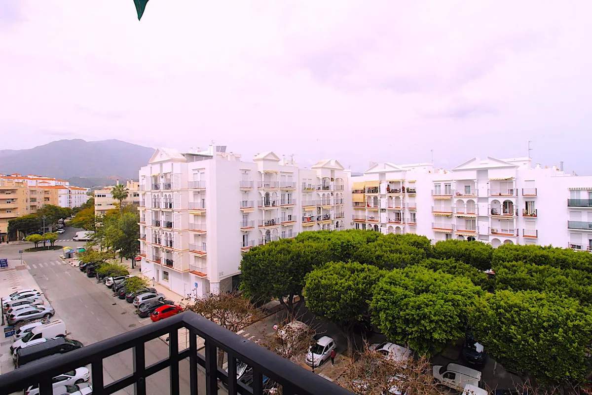 Charming Estepona Center Apartment with Mountain Views